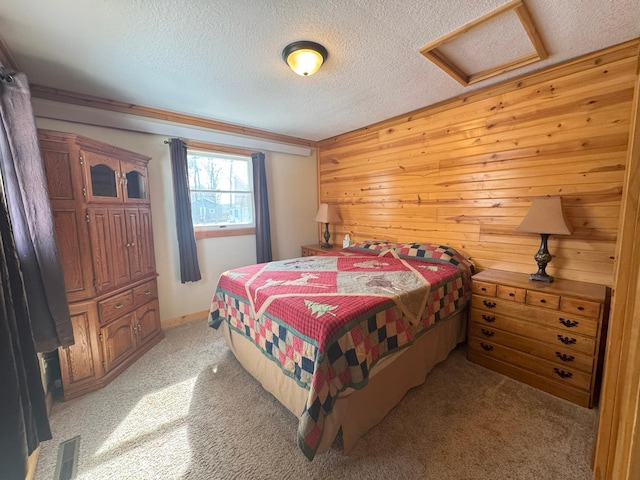 13150 Maple Circle Dr SE, Hudson Twp, MN 56334 - bedroom with attic access, light colored carpet, a textured ceiling, and wood walls
