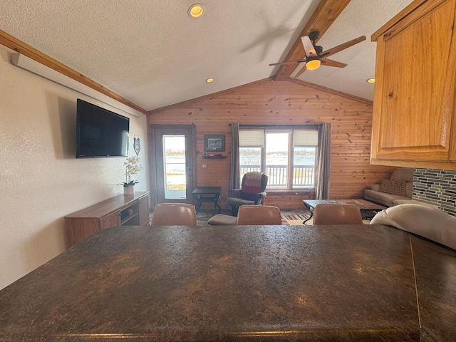 13150 Maple Circle Dr SE, Hudson Twp, MN 56334 - living area with a ceiling fan, wood walls, and a textured ceiling