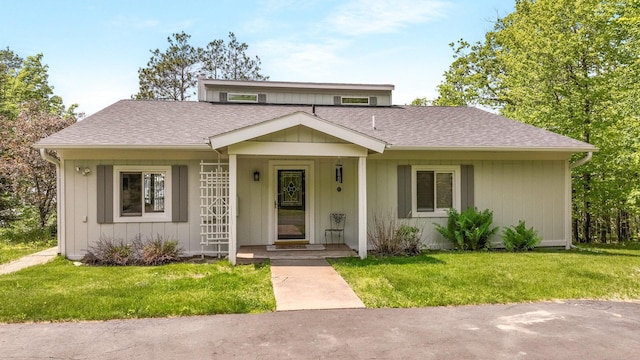 10787 Reynolds Rd, Round Lake Twp, WI 54843 - view of front of property with a front lawn and a shingled roof