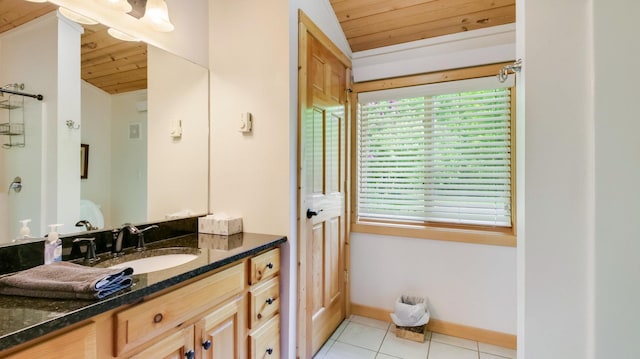 10787 Reynolds Rd, Round Lake Twp, WI 54843 - bathroom with wood ceiling, vanity, tile patterned floors, vaulted ceiling, and baseboards
