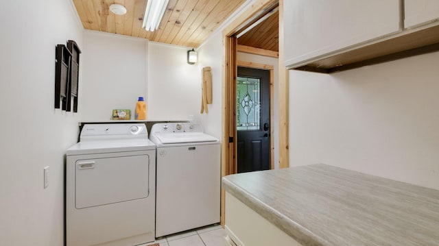 10787 Reynolds Rd, Round Lake Twp, WI 54843 - washroom with separate washer and dryer, cabinet space, wooden ceiling, and light tile patterned floors