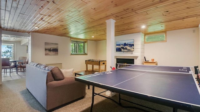 10787 Reynolds Rd, Round Lake Twp, WI 54843 - rec room with wooden ceiling, a warm lit fireplace, and recessed lighting