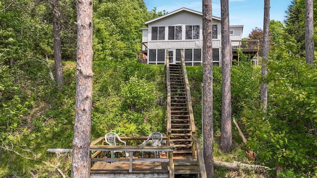 10787 Reynolds Rd, Round Lake Twp, WI 54843 - back of house featuring stairs and a wooden deck