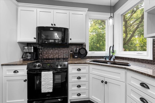 1848 141st Ln NE, Ham Lake, MN 55304 - kitchen with black appliances, tasteful backsplash, white cabinetry, dark stone countertops, and decorative light fixtures