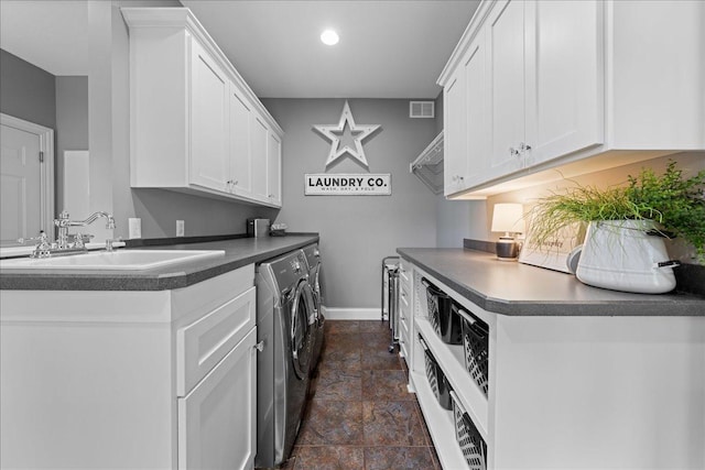 1848 141st Ln NE, Ham Lake, MN 55304 - washroom with washing machine and dryer, dark stone finish floors, cabinet space, and recessed lighting