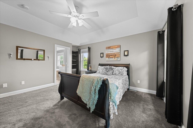 1848 141st Ln NE, Ham Lake, MN 55304 - carpeted bedroom with a tray ceiling, a ceiling fan, and ensuite bath