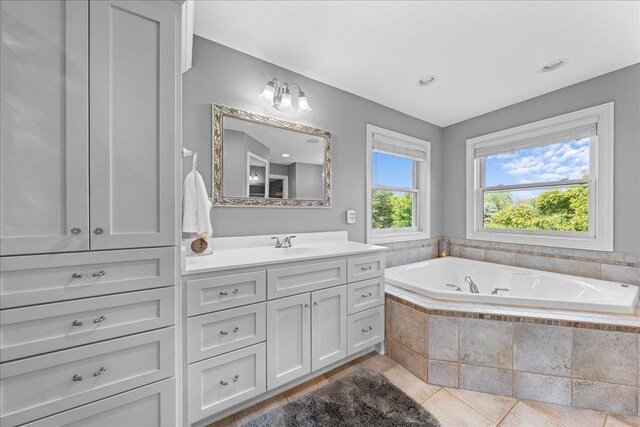 1848 141st Ln NE, Ham Lake, MN 55304 - full bath featuring vanity, a bath, and tile patterned flooring