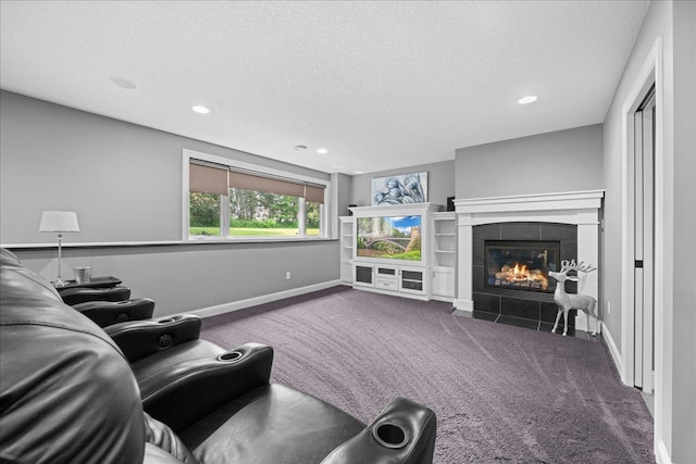 1848 141st Ln NE, Ham Lake, MN 55304 - carpeted living room featuring a textured ceiling, a tile fireplace, and recessed lighting