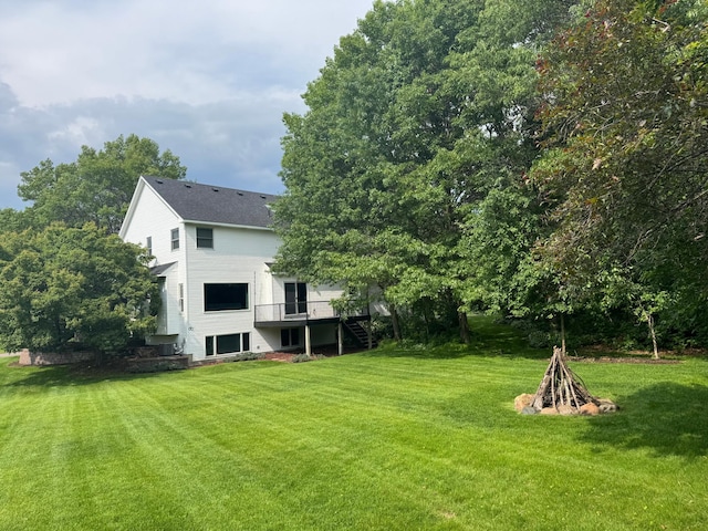 1848 141st Ln NE, Ham Lake, MN 55304 - view of green lawn featuring stairway and a wooden deck
