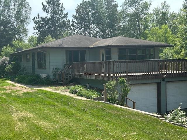 601 1st Ave, Grand Rapids, MN 55744 - view of front facade with a front lawn and a wooden deck