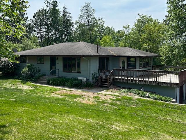 601 1st Ave, Grand Rapids, MN 55744 - ranch-style house with a front yard and a deck
