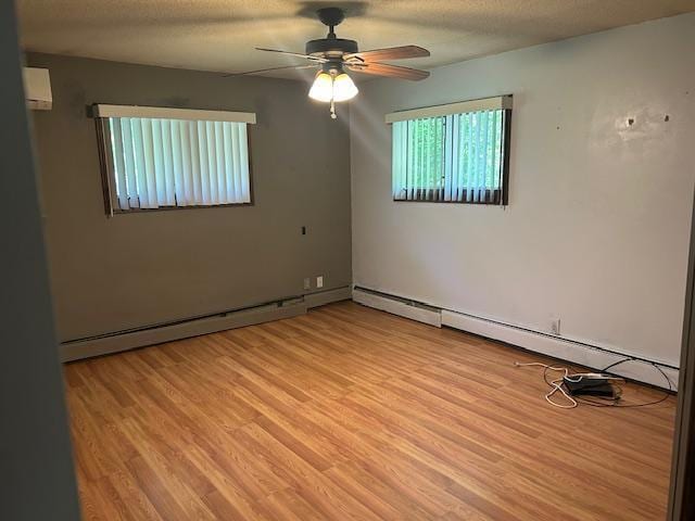 601 1st Ave, Grand Rapids, MN 55744 - unfurnished room with light wood-type flooring, ceiling fan, and baseboard heating