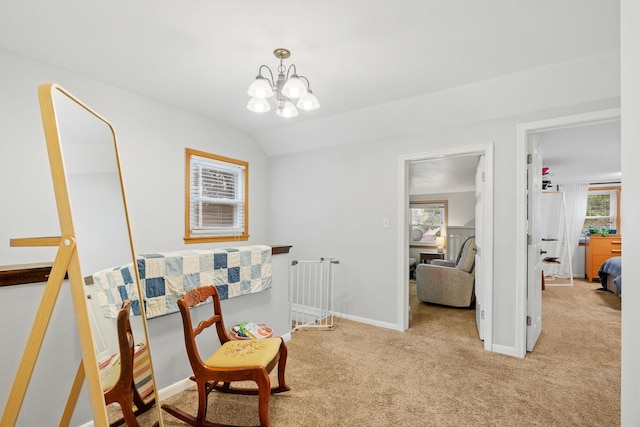 1714 5th St NE, Minneapolis, MN 55413 - sitting room featuring light carpet, plenty of natural light, a chandelier, vaulted ceiling, and baseboards