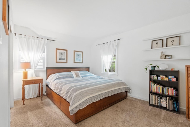 1714 5th St NE, Minneapolis, MN 55413 - carpeted bedroom with multiple windows and baseboards