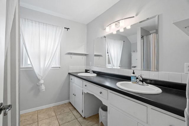 1714 5th St NE, Minneapolis, MN 55413 - full bathroom featuring double vanity, tile patterned floors, and baseboards