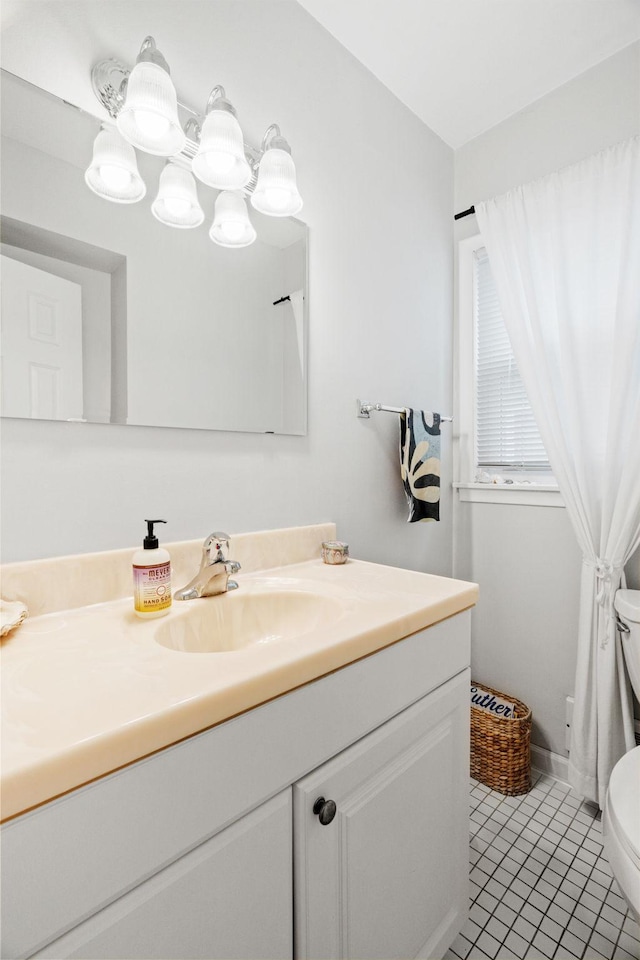 1714 5th St NE, Minneapolis, MN 55413 - bathroom featuring toilet, vanity, and tile patterned floors