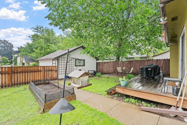 1714 5th St NE, Minneapolis, MN 55413 - view of yard with a garden, a deck, and an outdoor structure