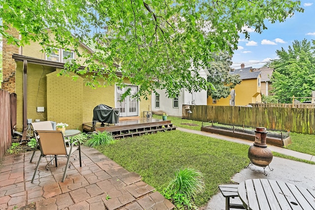 1714 5th St NE, Minneapolis, MN 55413 - view of yard featuring a patio area, a deck, and outdoor dining area