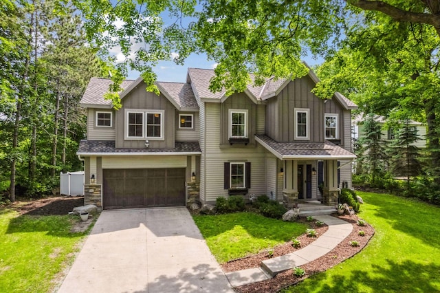 312 Barry Ave N, Wayzata, MN 55391 - view of front facade with board and batten siding, concrete driveway, an attached garage, a front yard, and stone siding