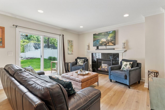 312 Barry Ave N, Wayzata, MN 55391 - living area featuring crown molding, light wood-style flooring, a tiled fireplace, recessed lighting, and baseboards
