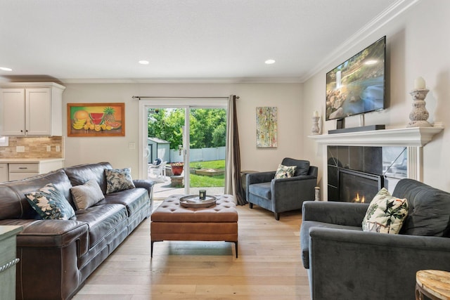 312 Barry Ave N, Wayzata, MN 55391 - living area featuring crown molding, light wood finished floors, recessed lighting, and a tiled fireplace