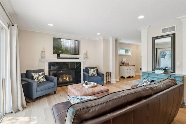 312 Barry Ave N, Wayzata, MN 55391 - living room with light wood finished floors, a fireplace, crown molding, recessed lighting, and baseboards