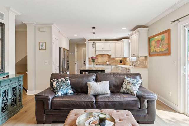 312 Barry Ave N, Wayzata, MN 55391 - living area featuring light wood-style floors, baseboards, crown molding, and recessed lighting