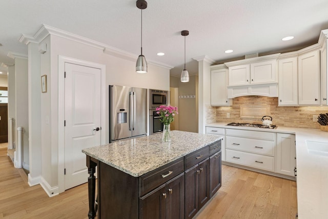 312 Barry Ave N, Wayzata, MN 55391 - kitchen with appliances with stainless steel finishes, ornamental molding, white cabinetry, backsplash, and light wood-type flooring