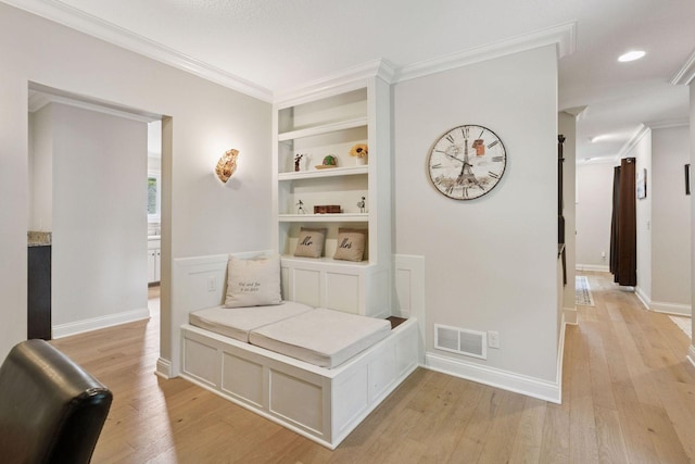 312 Barry Ave N, Wayzata, MN 55391 - hallway featuring light wood finished floors, built in shelves, ornamental molding, baseboards, and recessed lighting