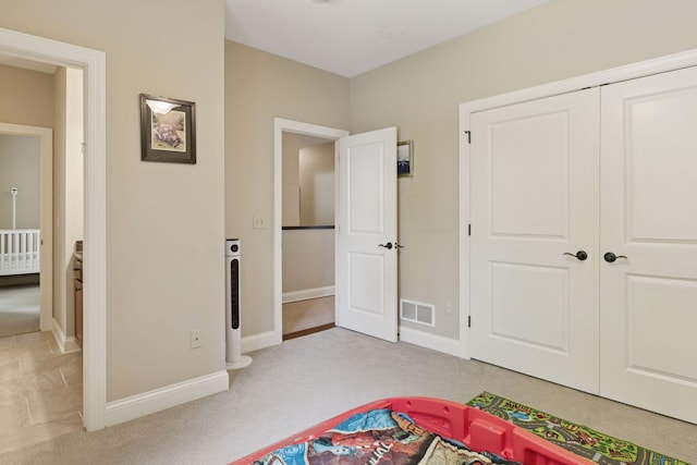 312 Barry Ave N, Wayzata, MN 55391 - unfurnished bedroom with carpet floors, baseboards, and a closet