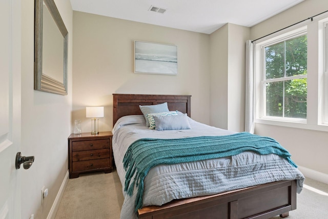 312 Barry Ave N, Wayzata, MN 55391 - carpeted bedroom featuring baseboards and multiple windows