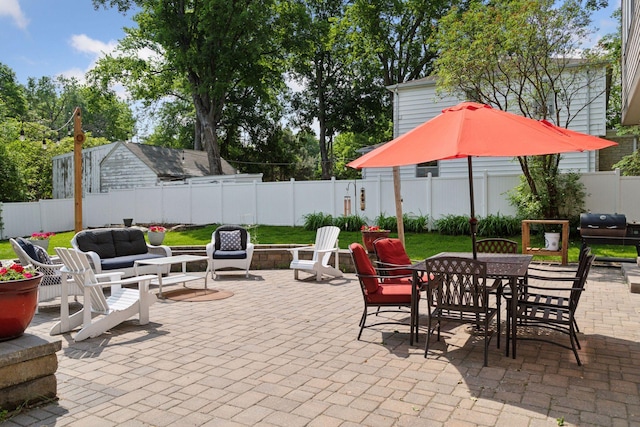 312 Barry Ave N, Wayzata, MN 55391 - fenced backyard with a patio, outdoor dining space, grilling area, and outdoor lounge area