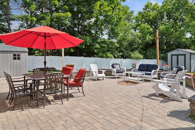 312 Barry Ave N, Wayzata, MN 55391 - fenced backyard featuring a patio, an outdoor hangout area, outdoor dining area, and view of scattered trees