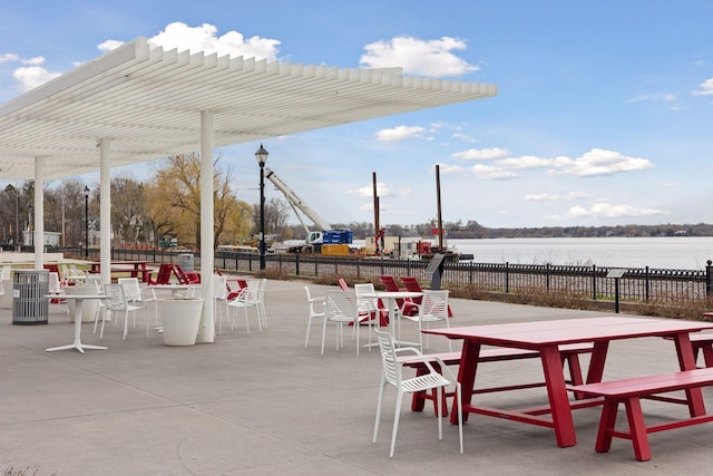 312 Barry Ave N, Wayzata, MN 55391 - view of patio featuring a water view, outdoor dining space, and a pergola