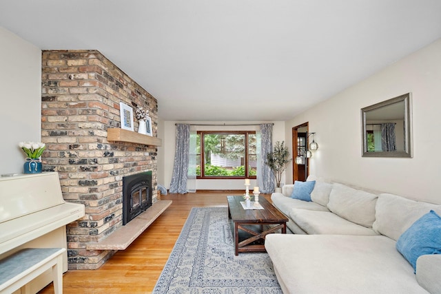 135 Glen Creek Rd NE, Fridley, MN 55432 - living area with wood finished floors and a fireplace