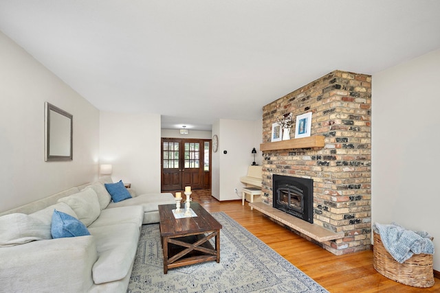 135 Glen Creek Rd NE, Fridley, MN 55432 - living area featuring wood finished floors and a brick fireplace