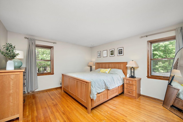 135 Glen Creek Rd NE, Fridley, MN 55432 - bedroom featuring light wood-type flooring and baseboards