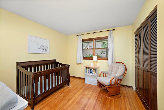 135 Glen Creek Rd NE, Fridley, MN 55432 - bedroom with wood finished floors, a closet, and a nursery area