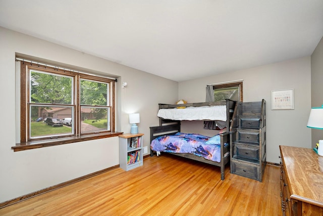 135 Glen Creek Rd NE, Fridley, MN 55432 - bedroom with light wood finished floors and baseboards