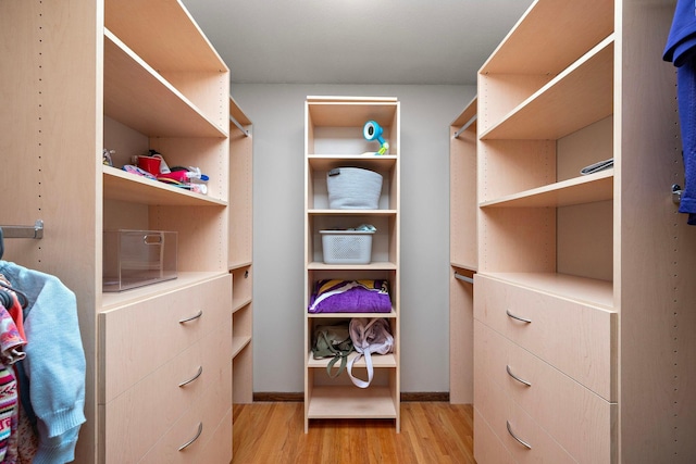 135 Glen Creek Rd NE, Fridley, MN 55432 - walk in closet featuring light wood finished floors