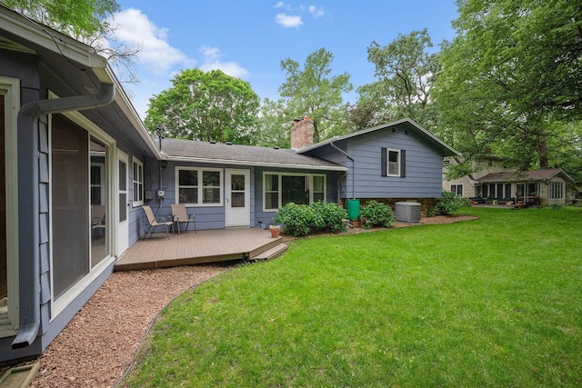135 Glen Creek Rd NE, Fridley, MN 55432 - rear view of house featuring a chimney, a deck, and a lawn