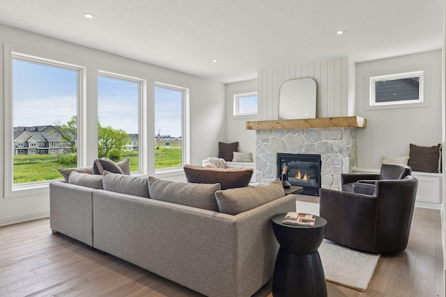 10172 Peony Ln N, Maple Grove, MN 55311 - living room with a fireplace, wood finished floors, and recessed lighting