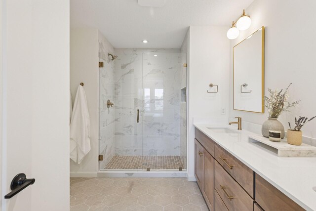 10172 Peony Ln N, Maple Grove, MN 55311 - full bathroom featuring double vanity, a marble finish shower, recessed lighting, tile patterned flooring, and baseboards