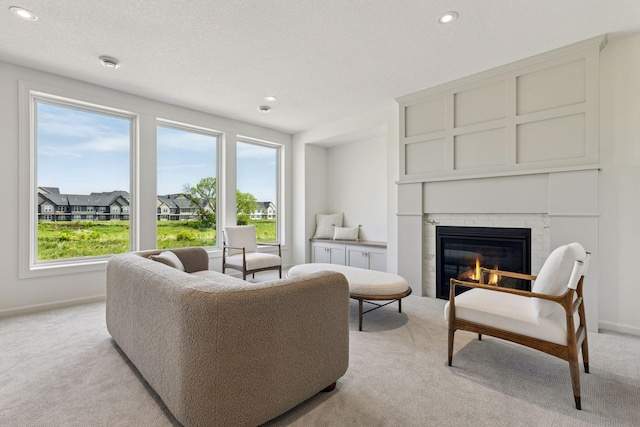 10172 Peony Ln N, Maple Grove, MN 55311 - living area with light colored carpet, a fireplace, recessed lighting, and baseboards