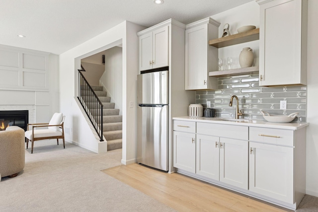 10172 Peony Ln N, Maple Grove, MN 55311 - kitchen with freestanding refrigerator, a sink, open shelves, light countertops, and recessed lighting