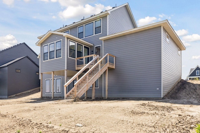 10172 Peony Ln N, Maple Grove, MN 55311 - back of house featuring stairs and a wooden deck