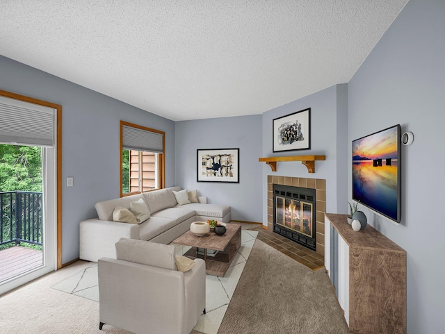 1626 Raindrop Dr, Eagan, MN 55121 - living room with healthy amount of natural light, a tiled fireplace, a textured ceiling, and light colored carpet