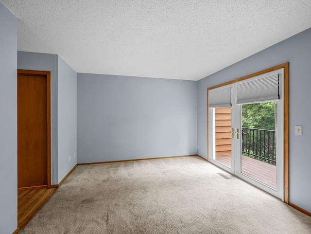 1626 Raindrop Dr, Eagan, MN 55121 - spare room featuring carpet flooring and a textured ceiling