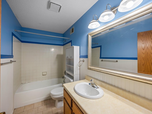 1626 Raindrop Dr, Eagan, MN 55121 - bathroom featuring vanity, bathtub / shower combination, a textured ceiling, tile patterned flooring, and a wainscoted wall