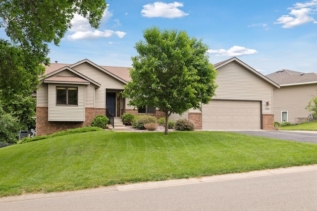 20886 Jenkins Way, Lakeville, MN 55044 - view of front facade with brick siding, driveway, an attached garage, and a front yard